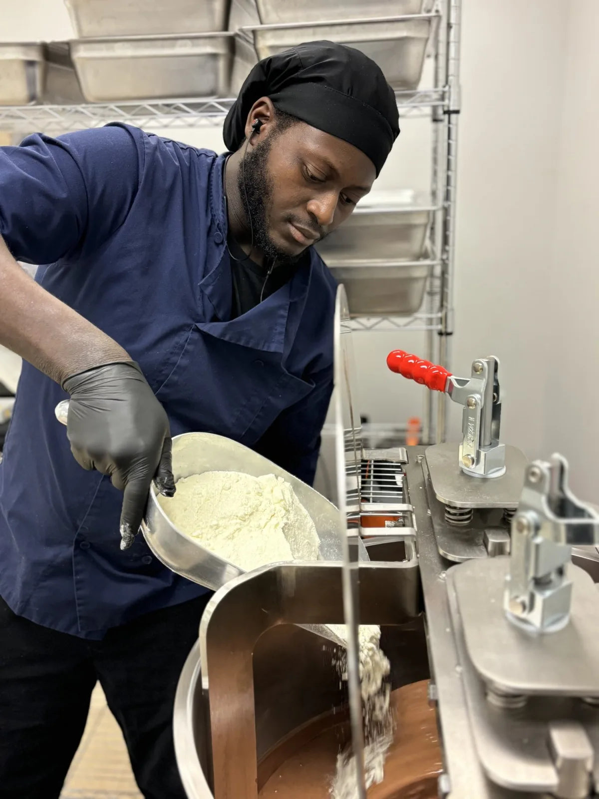 Kofi, Head of Bean-to-Bar Development, making a batch of chocolate in Chattanooga