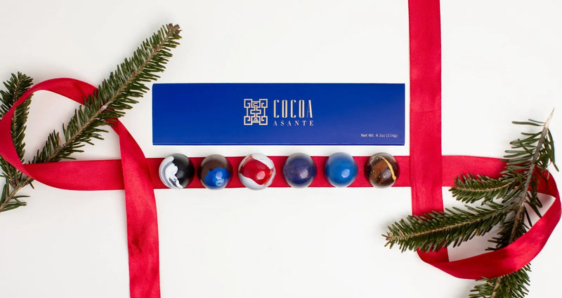 Assorted bonbons with colorful hand-painted shells in a variety gift box