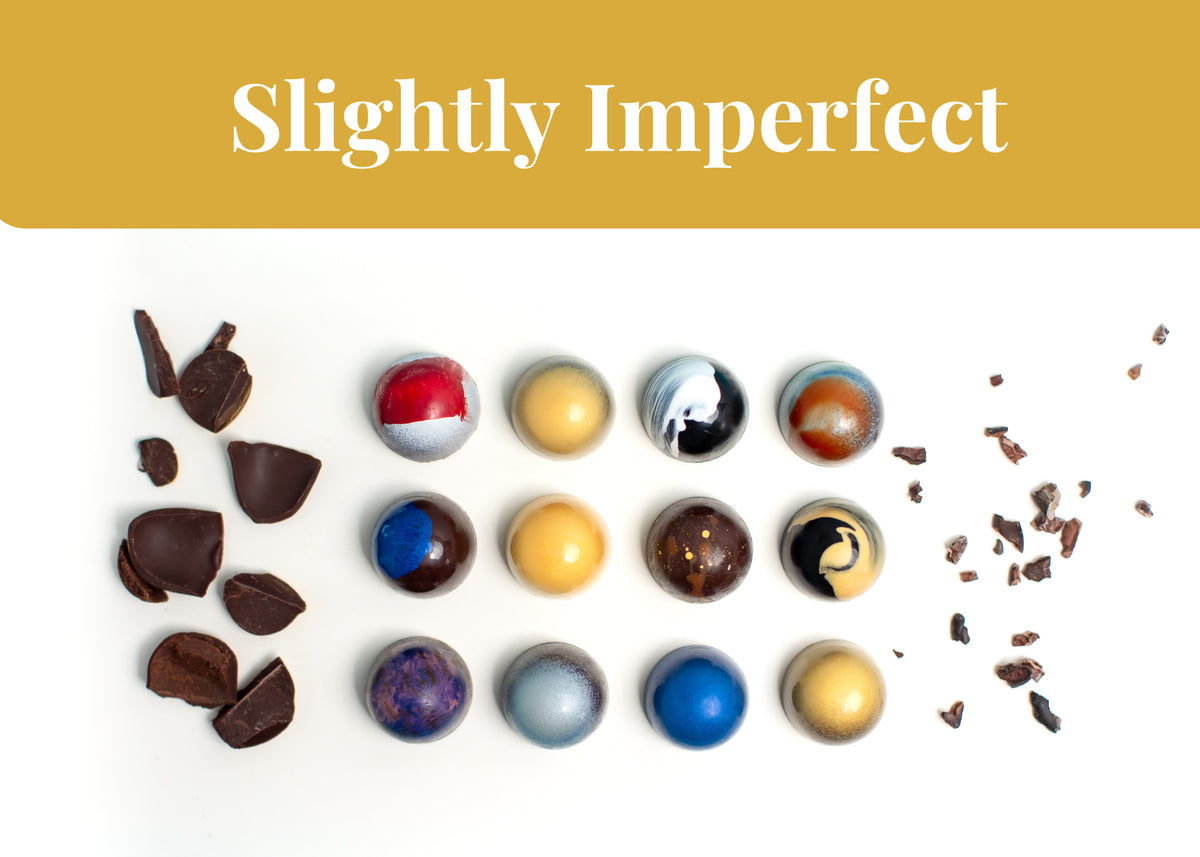 Assorted handmade bonbons with minor cosmetic imperfections in a box