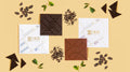 Two single-origin chocolate bars, one 60% dark and one 37.5% milk, side by side